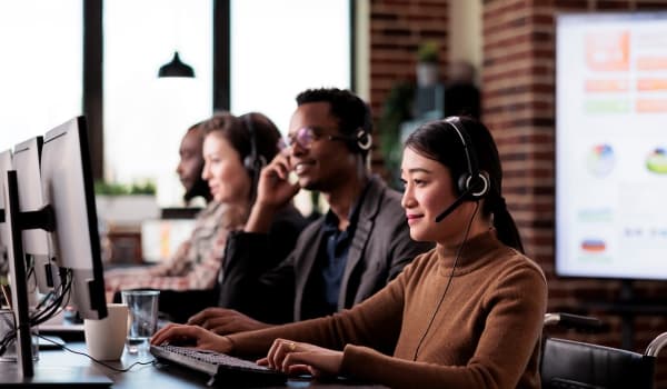 Customer service team at work in office